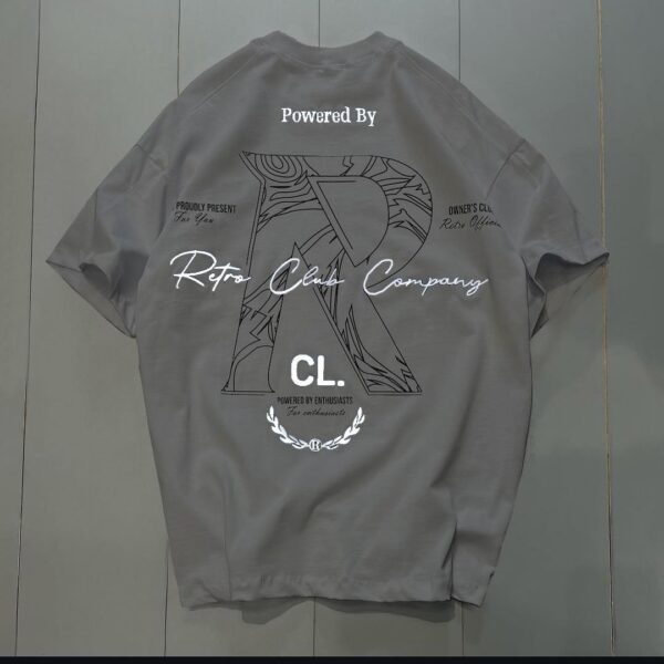 **Alt Text:** Oversized drop shoulder t-shirt with bold front and back "R" print, made from soft PC Jersey fabric. Available in black, brown, and grey, in sizes medium, large, and extra large.