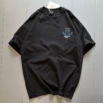 **Alt Text:** Oversized drop shoulder t-shirt with bold front and back "R" print, made from soft PC Jersey fabric. Available in black, brown, and grey, in sizes medium, large, and extra large.