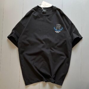 **Alt Text:** Oversized drop shoulder t-shirt with bold front and back "R" print, made from soft PC Jersey fabric. Available in black, brown, and grey, in sizes medium, large, and extra large.